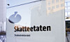 Skilt ved inngangen til Skatteetaten med logo og teksten Skatteetaten og Skattedirektoratet.